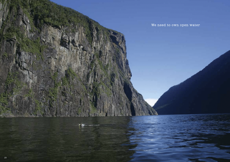Geoff Matthews pictured here swimming across Milford Sound to get images for Blueseventy's global marketing collateral.